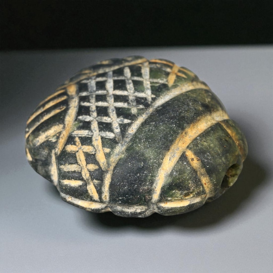 Ancient Egyptian New Kingdom Scarabiform Steatite Amulet, c. 1550-1069 BCE, 3.1cm, 33B: This finely carved steatite amulet, shaped in the form of a scarab beetle, originates from the Egyptian New Kingdom period (c. 1550-1069 BCE) - an era renowned for its flourishing art, monumental arch