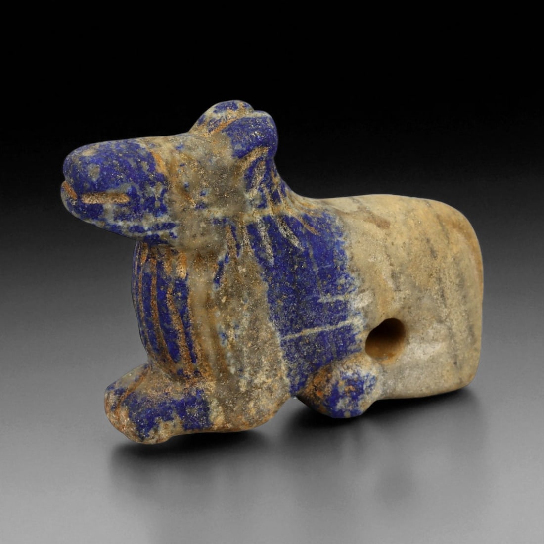 Ancient Bactrian Lapis Lazuli Lion Effigy, c. 2nd-1st Millennium BCE, 6cm, 40DP: This striking lapis lazuli effigy, carved in the form of a recumbent lion, originates from ancient Bactria, circa 2nd-1st millennium BCE. Sculpted from vibrant blue lapis lazuli streaked with veins of