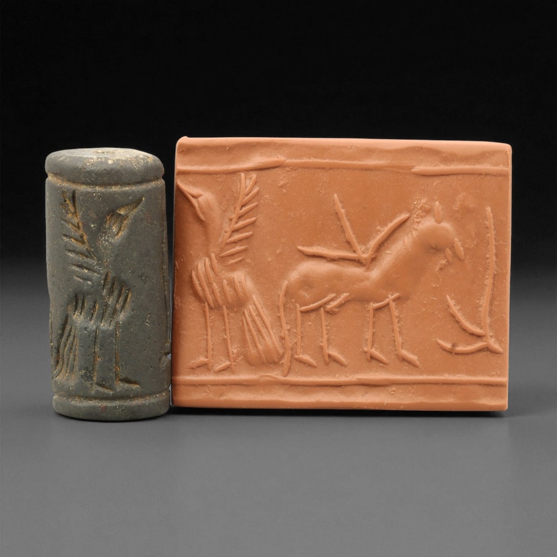 Ancient Mesopotamian Akkadian Steatite Cylinder Seal, c. 2300-2100 BCE, 4cm, 81EL: Carved from fine dark steatite, this ancient Akkadian cylinder seal dates to the late 3rd millennium BCE, a period when Mesopotamian artisans perfected the art of miniature relief engraving. Each seal