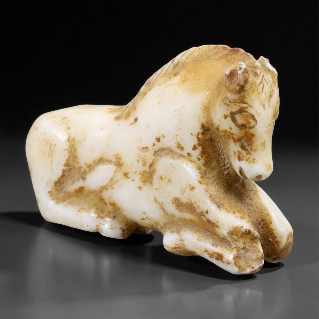 Ancient Achaemenid Marble Horse Figurine, c. 6th-4th Century BCE, 7.2cm, 24ER: This graceful marble horse figurine, dating to the Achaemenid Persian Empire (c. 6th-4th century BCE), reflects the refined artistry and symbolic reverence for the horse within one of the ancient worl