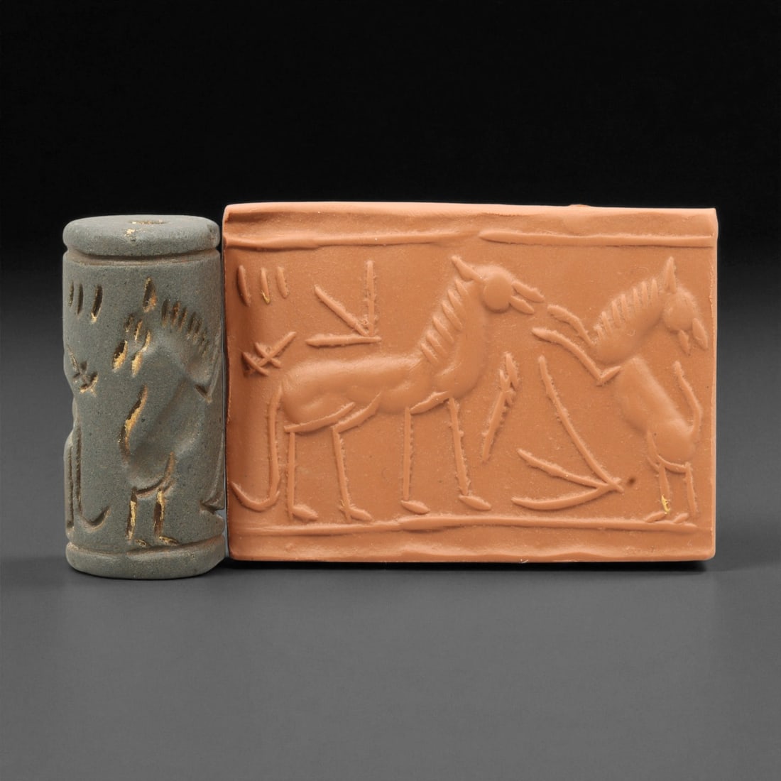 Ancient Mesopotamian Akkadian Steatite Cylinder Seal, c. 2300-2100 BCE, 4.2cm, 72EL: Carved from fine dark steatite, this ancient Akkadian cylinder seal dates to the late 3rd millennium BCE, a period when Mesopotamian artisans perfected the art of miniature relief engraving. Each seal