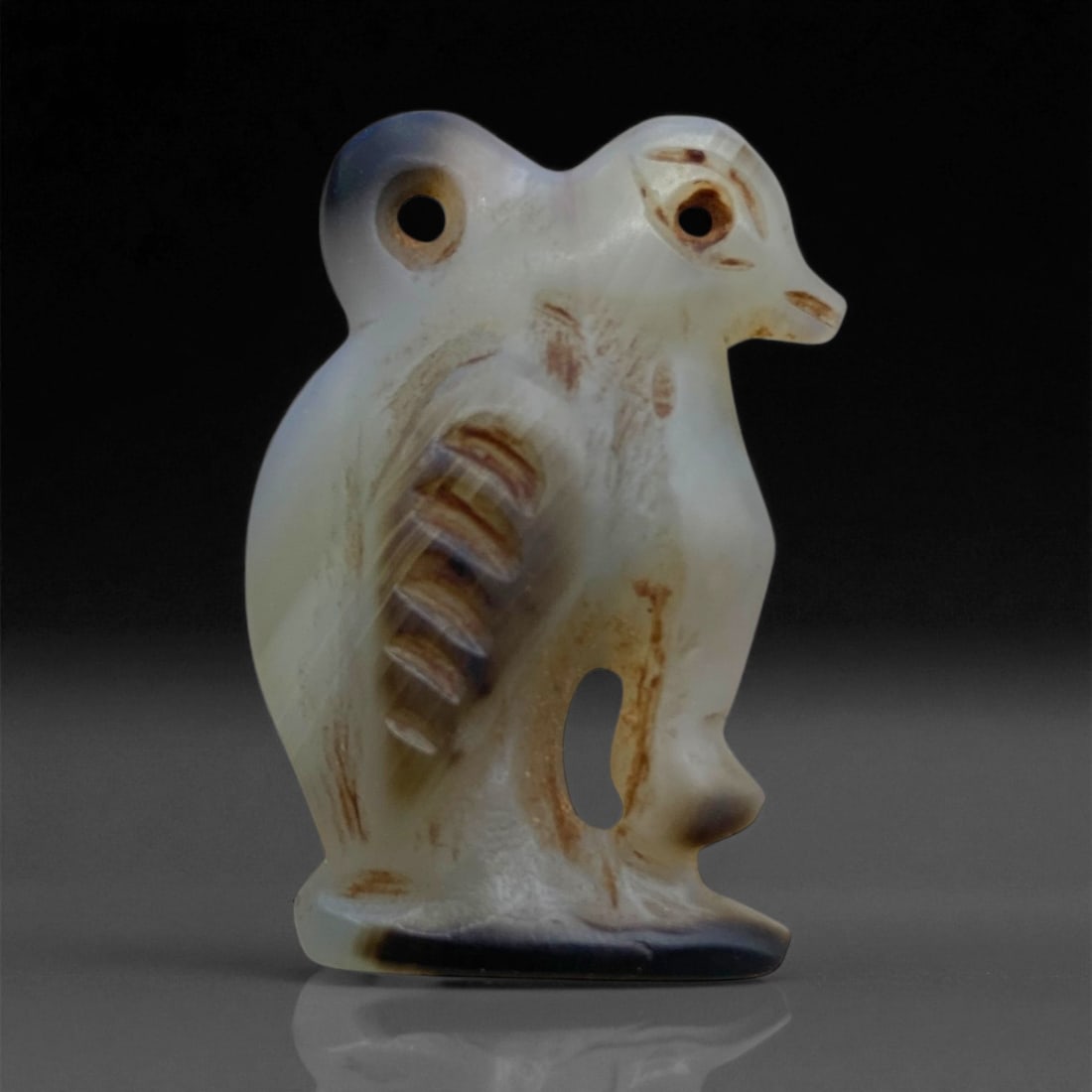 Ancient Coptic Egyptian Falcon-Form Agate Amulet, c. 4th-7th Century CE, 2.5cm, 4g, 75AA: This delicately carved agate amulet, depicting a stylized falcon, hails from Coptic Egypt during the late Roman to early Byzantine transition, c. 4th-7th century CE. The falcon, long a sacred animal i