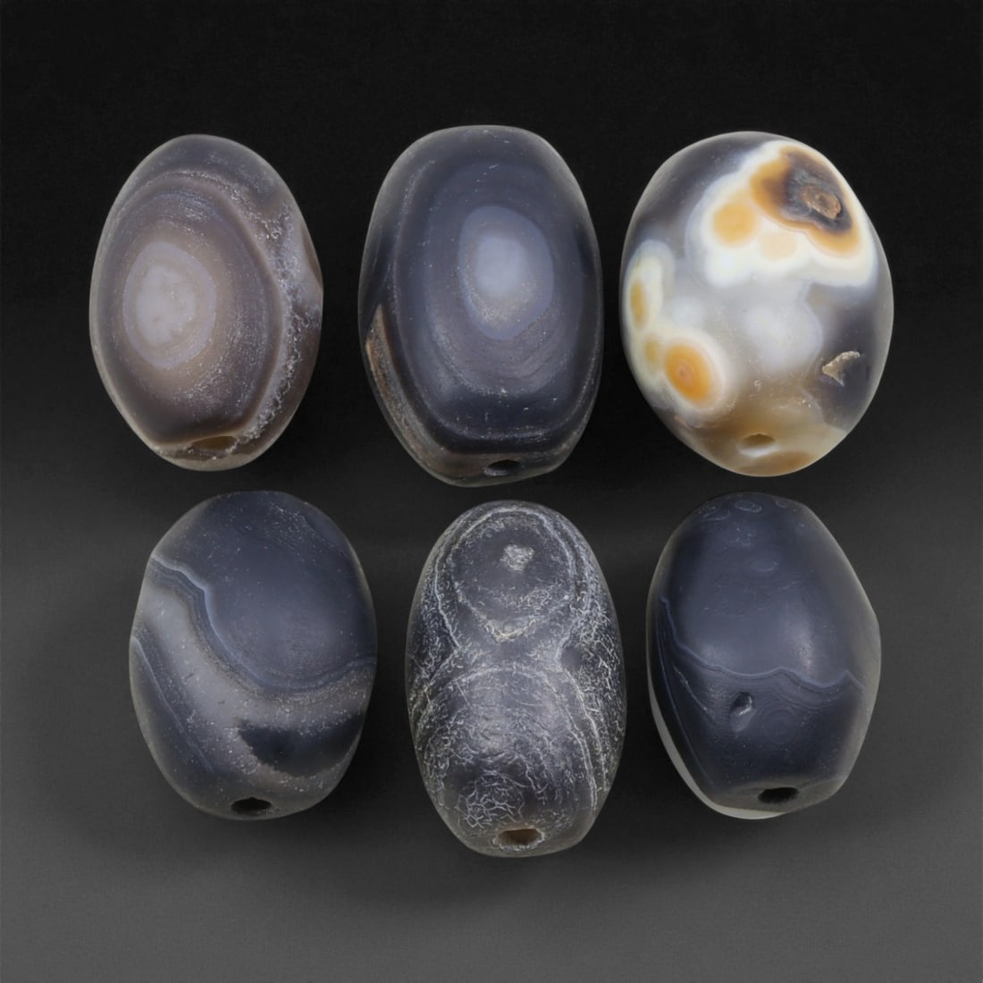 Ancient Medieval Sulaimani Agate Beads, c. 11th-14th Century CE, 2.3-2.6cm, 4EL: This elegant group of Sulaimani agate beads originates from the Indo-Persian cultural sphere of the 11th-14th centuries CE, a period when trade and craftsmanship flourished across Central and South As
