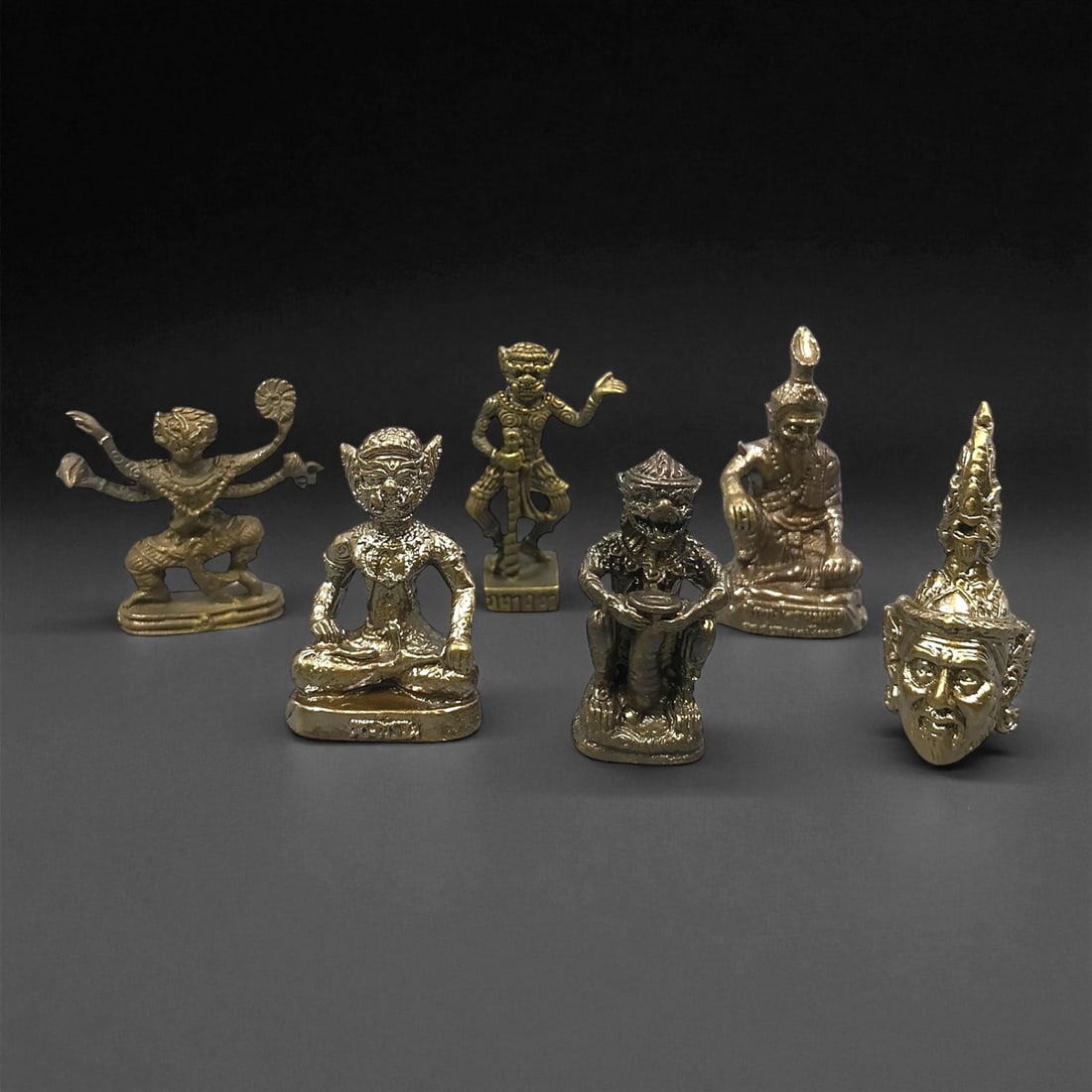 Vintage Thai Mythic and Protective Bronze Figurine Set, c. 20th Century 3.1-3.5cm, 85ER: This set of six vintage Thai bronze figurines reflects the vivid pantheon of mythic guardians, folk spirits, and protective figures that form a central part of Thailand's spiritual culture. The group 