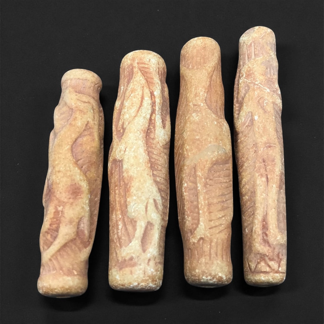 Ancient Indo Parthian Faunal Relief Cylinders, c. 1st-2nd Century CE 6-7.2cm, 42ET: These four ancient Indo Parthian relief cylinders, each measuring between 6 and 7.2 cm, present a rare glimpse into the artistic vocabulary of the Indo Parthian realm, where Iranian, Central Asian, an