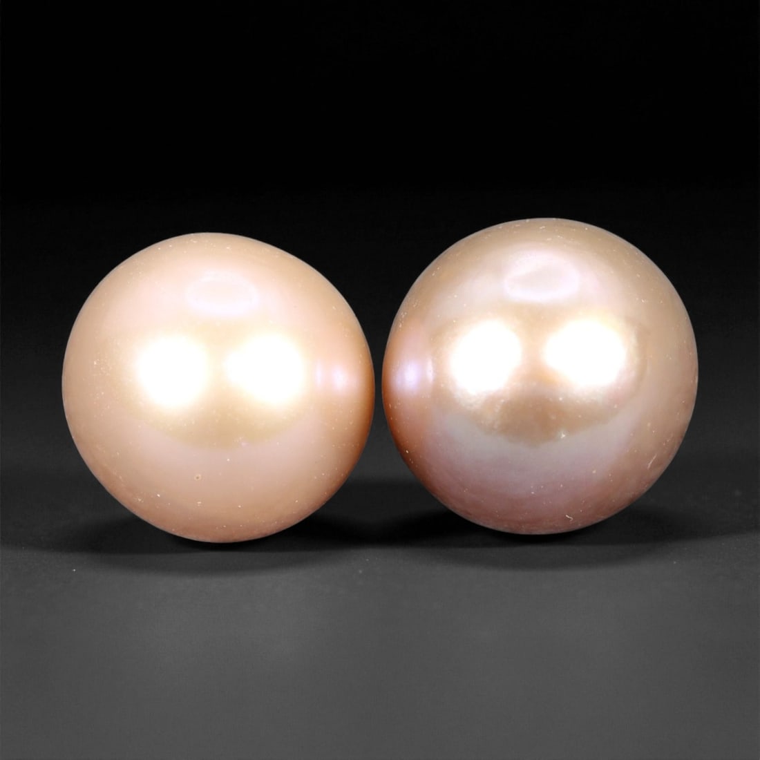 8.00 mm Light Peach-Pink Freshwater Pearl Pair - Natural Round Selection, 25XF: This graceful freshwater pearl pair glows with soft peach-pink hues, complemented by a delicate golden warmth that radiates under both natural and studio lighting. Their gentle overtone and silky surf