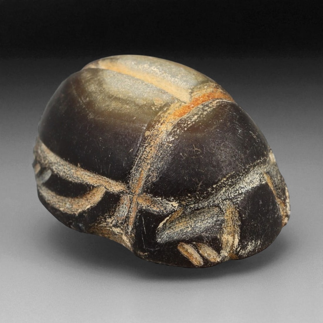 Ancient Egyptian Banded Agate Scarab Amulet, c. 1070-664 BCE 2 cm (0.79 in), 64WD: This finely carved scarab amulet, crafted from lustrous banded agate, dates to Egypt's Third Intermediate Period (c. 1070-664 BCE). During this era, scarabs continued to serve as powerful emblems of r