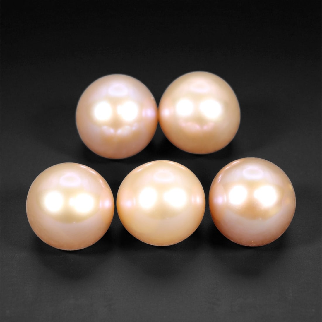6.00 mm Soft Blush Freshwater Pearl Lot - Natural Round Set of Five, 97XE: This charming group of five freshwater pearls features a soft gradient of blush, peach, and champagne tones, unified by their smooth surfaces and gentle glow. Each pearl reflects light with a warm, sa