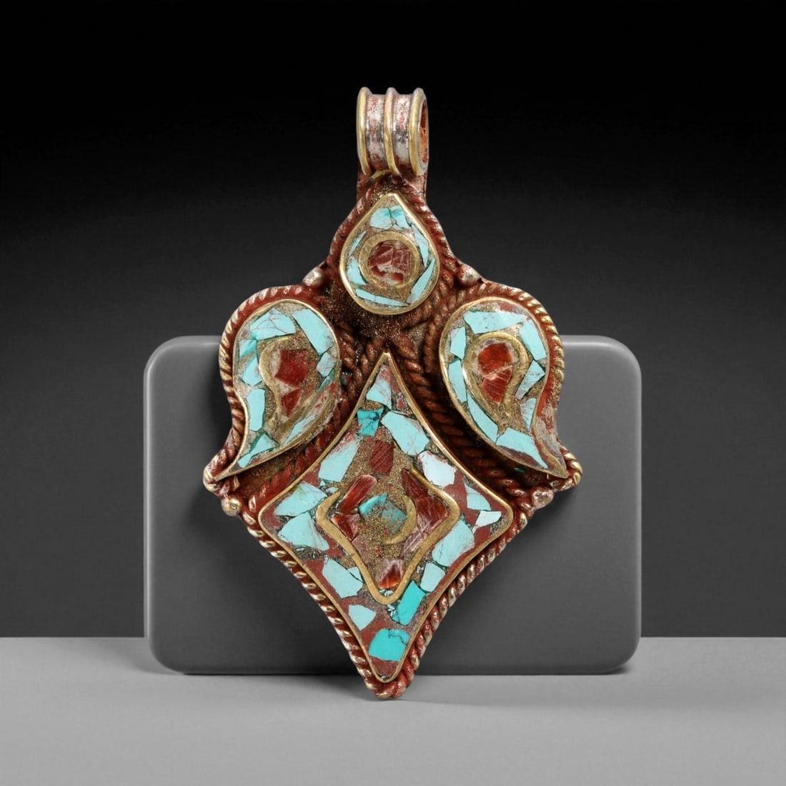 Vintage Himalayan Coral Turquoise Mosaic Bronze Pendant, 20th Century, 6.1cm, 92CE: This vintage Himalayan pendant radiates tribal artistry, crafted in bronze with an intricate mosaic of turquoise and coral. Shaped as a diamond framed by three teardrop settings, it carries both symme