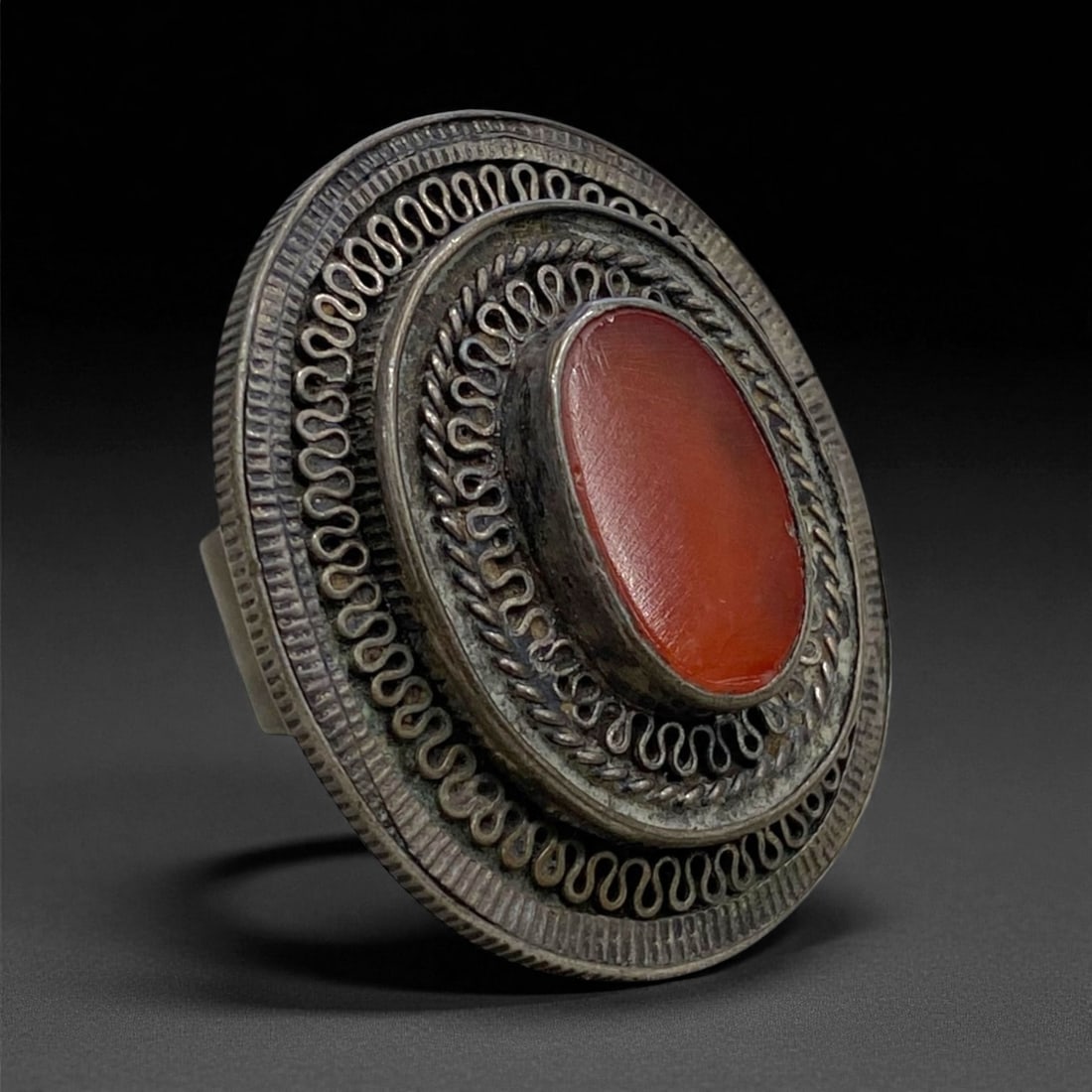 Antique Mughal-Style Carnelian Silver Filigree Ring, c. 18th-19th Century, US 9 24g, 78BB: This impressive antique ring exemplifies the grandeur of late Mughal and early Indo-Islamic artistry, where refined filigree silverwork met the spiritual allure of carnelian. The ring's large, oval re
