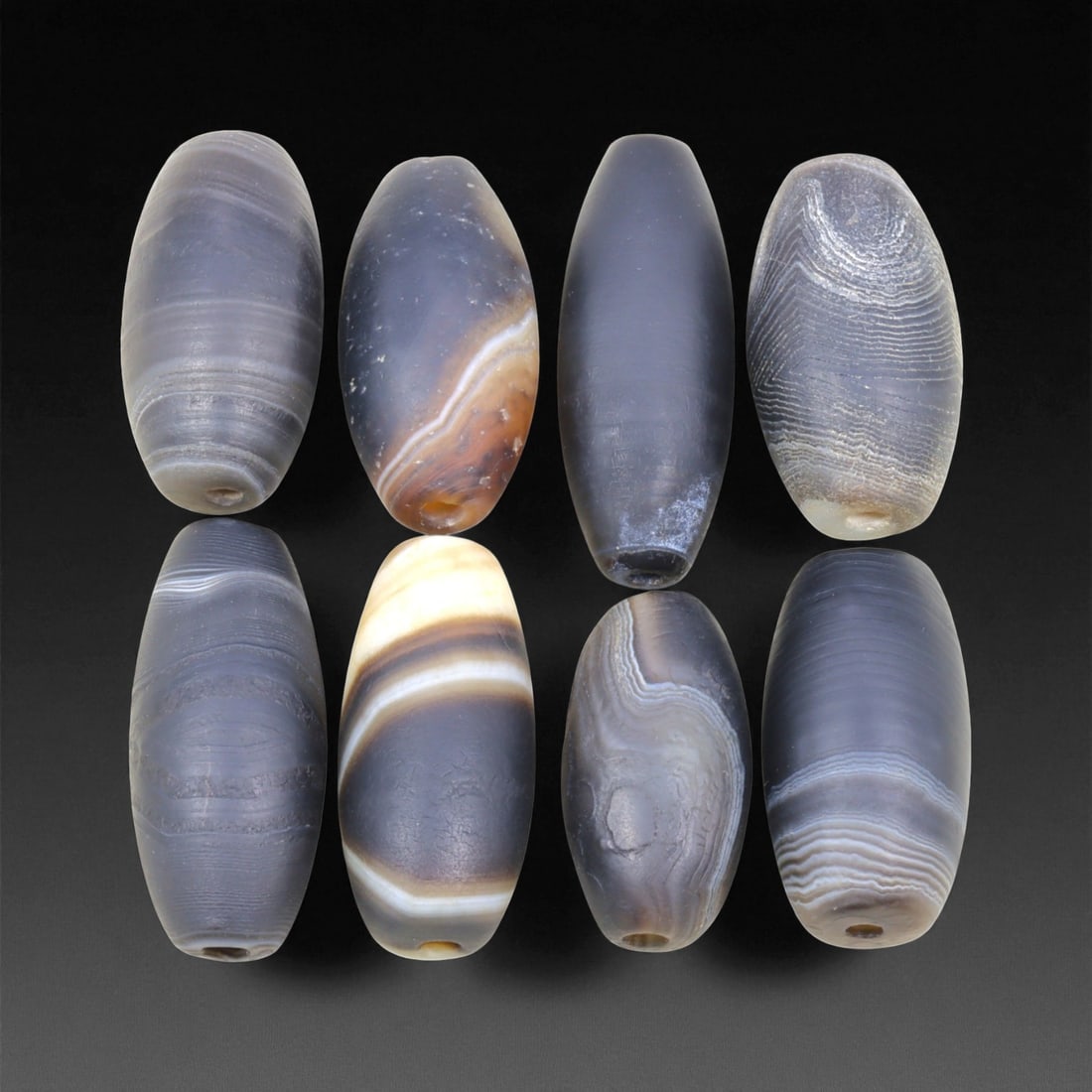 Ancient Medieval Sulaimani Agate Beads, c. 11th-14th Century CE, 2.7-3.5 cm, 5EL: This elegant group of Sulaimani agate beads originates from the Indo-Persian cultural sphere of the 11th-14th centuries CE, a period when trade and craftsmanship flourished across Central and South As