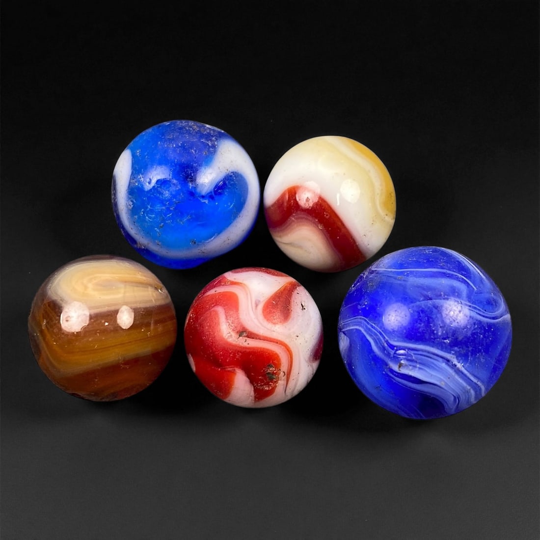 Vintage Glass Marbles Lot, Mid-20th Century, 1.5-1.8cm, 80EK: This charming lot of vintage glass marbles, dating from the mid-20th century, reflects the artistry and playfulness of early handmade and molded glass craftsmanship. These marbles were produced during