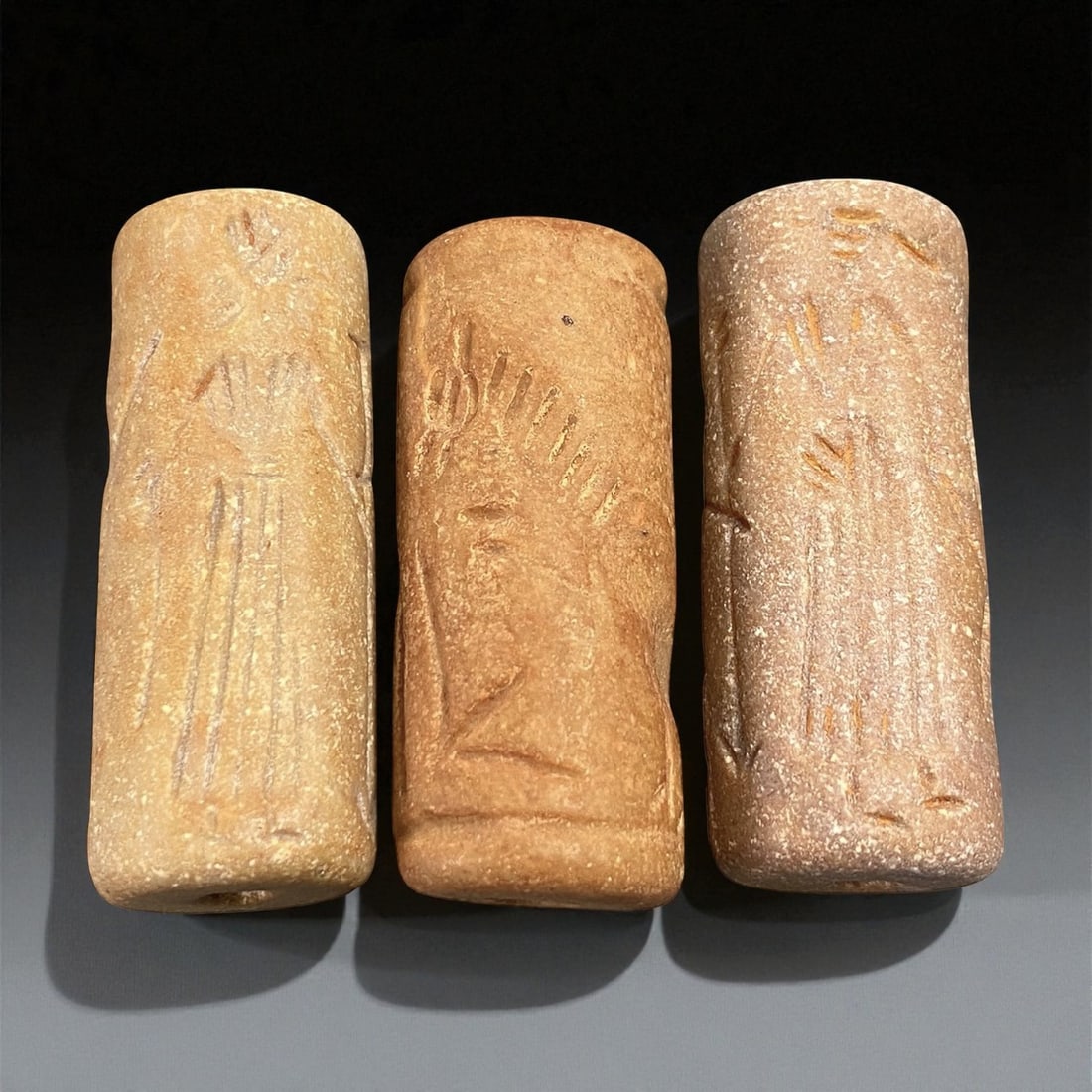 Ancient Akkadian Stone Cylinder Seals, c. 23rd-21st Century BCE, 3.9-4 cm, 79EP: These three finely carved cylinder seals originate from the Akkadian Empire, one of Mesopotamia's earliest and most influential civilizations, flourishing around the 23rd-21st century BCE. Crafted fro