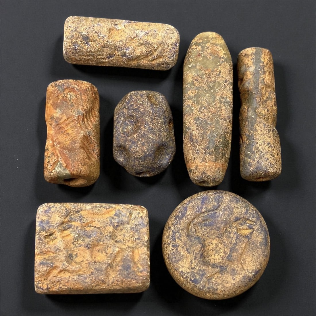 Ancient Akkadian Lapis Lazuli Beads and Amulets, c. 23rd-21st Century BCE, 1.5-3 cm, 51EK: This collection of seven lapis lazuli beads and amulets dates to the Akkadian Empire, a pinnacle of early Mesopotamian civilization (c. 23rd-21st century BCE). Each piece is skillfully carved from lap