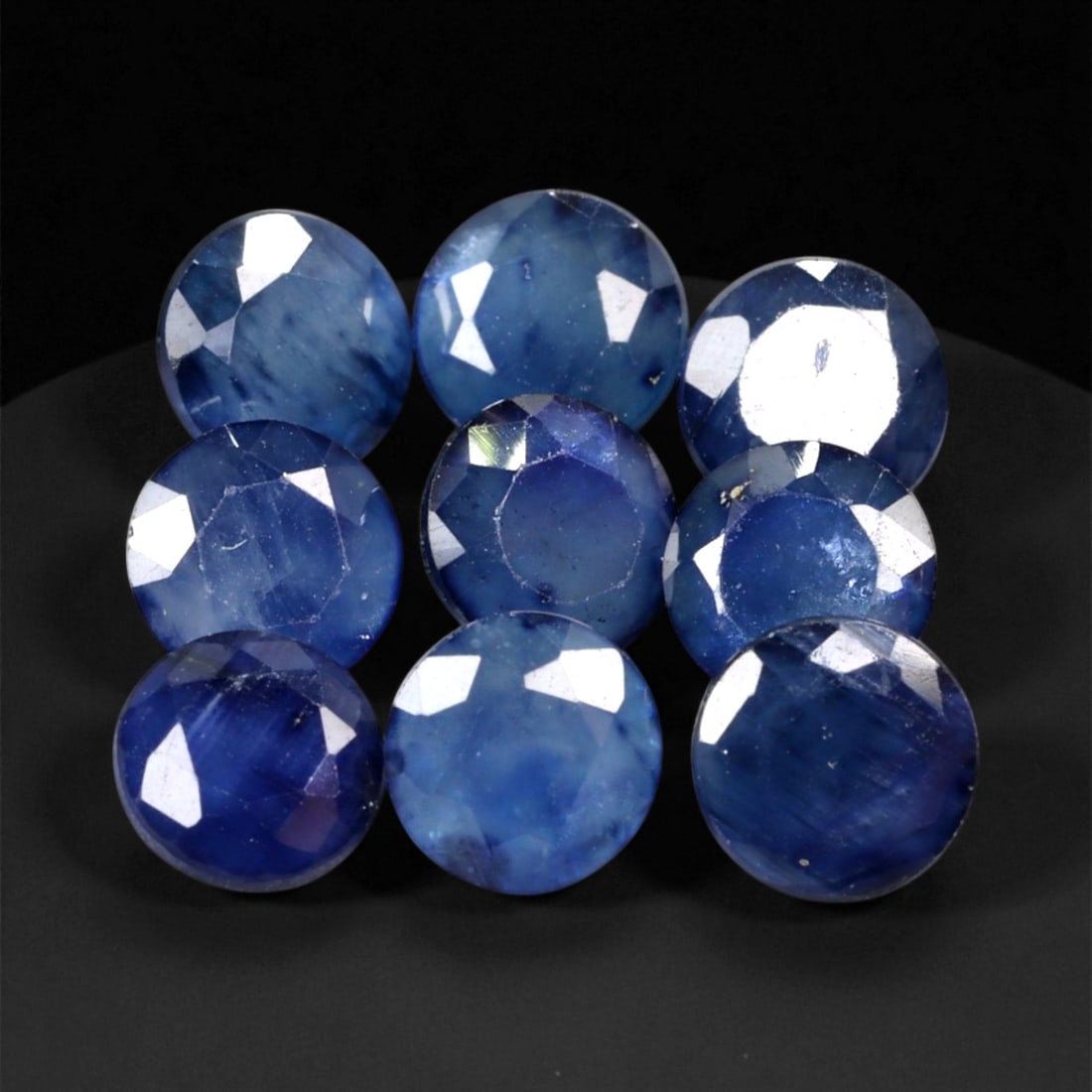 5.51 Carats Deep Blue Sapphire Parcel - Natural Sri Lankan Stones - 5 x 3 mm, 6XE: This richly toned parcel of round-cut blue sapphires showcases a medley of deep royal and midnight blues, accentuated by natural zoning and silky inclusions that reflect their organic origin. Each gem