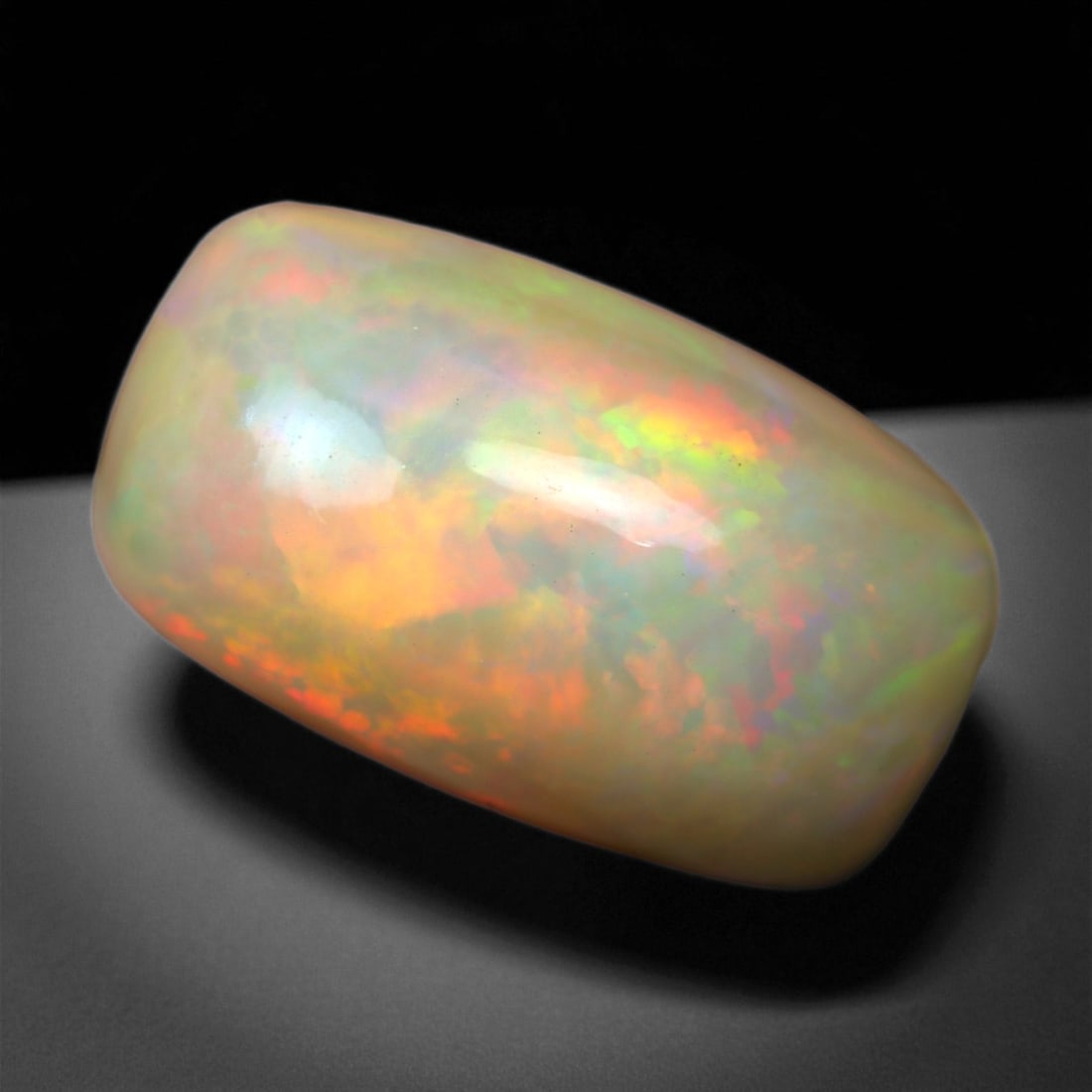13.20 Carats Multicolor Opal Selection - Natural Welo Ethiopian Stones, 85XC: This luminous selection of Welo opals dazzles with vibrant play-of-color, ranging from electric greens and cobalt blues to sunlit oranges and flashes of violet. Each cabochon has been hand-selected fo