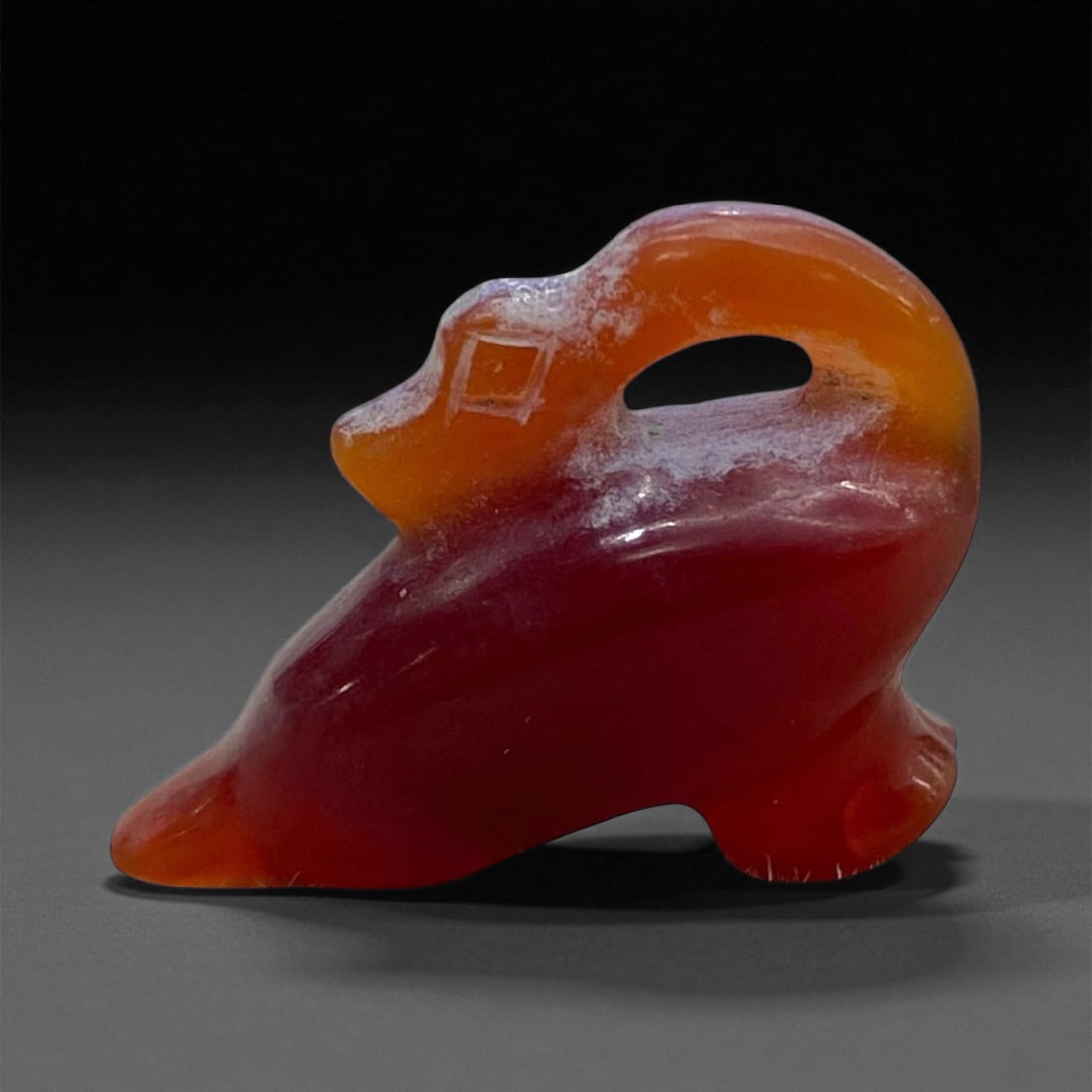 Ancient Egyptian Carnelian Duck Amulet, c. New Kingdom Period, 16th-11th Century BCE, 3cm, 6g, 89AA: This beautifully carved carnelian amulet represents a stylized duck or waterfowl, a motif deeply embedded in the spiritual and artistic symbolism of Ancient Egypt. Dating to the New Kingdom period (c.
