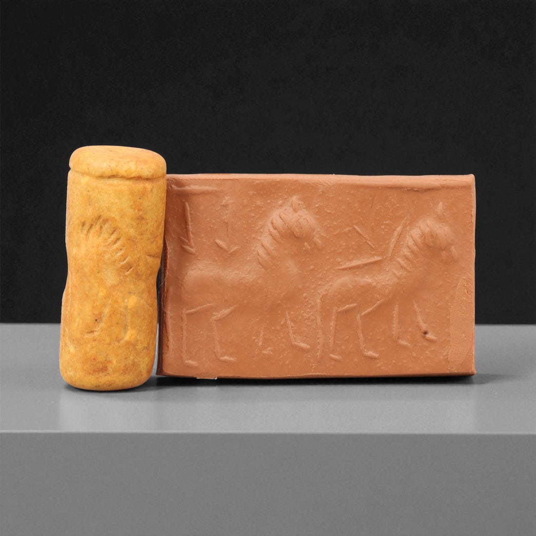 Ancient Near Eastern Iconographic Cylinder Seal, c. 2000-1000 BCE, 4cm, 83M: A striking relic from the dawn of civilization, this ancient Mesopotamian cylinder seal dates to the 2nd-1st millennium BCE - a period when art, writing, and ritual became inseparable expressions of c