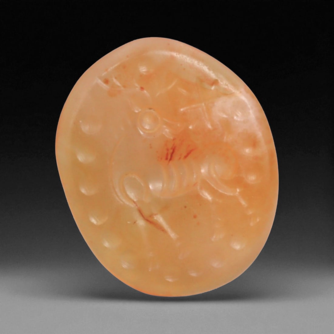 Ancient Sasanian Carnelian Intaglio with Engraving Motif, 1.8cm, 2g, 80BC: This carnelian intaglio, finely engraved into the warm red tones of semi-precious stone, reflects a tradition of craftsmanship spanning from the classical world to the early modern era. Intaglios serv