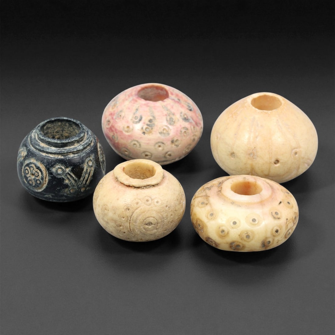 Ancient Near Eastern Bone Spindle Whorl c. 1st Mill BCE 1.4-1.7cm, 68ER: This ancient bone spindle whorl reflects the textile traditions that flourished across the Near East during the 1st millennium BCE, when finely made spinning tools were essential to daily life and oft