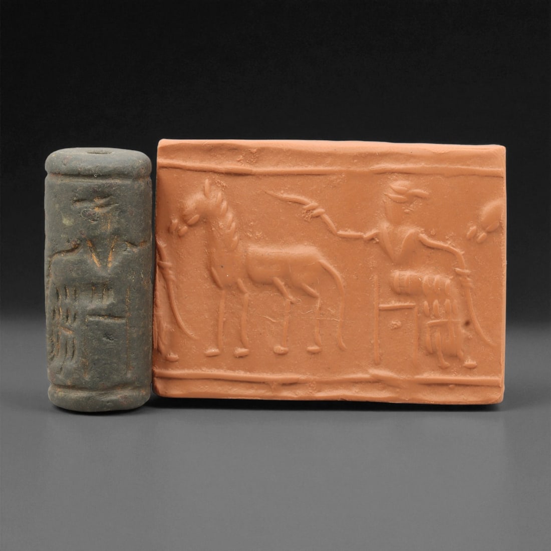 Ancient Mesopotamian Akkadian Steatite Cylinder Seal, c. 2300-2100 BCE, 4cm, 4EV: Carved from fine dark steatite, this ancient Akkadian cylinder seal dates to the late 3rd millennium BCE, a period when Mesopotamian artisans perfected the art of miniature relief engraving. Each seal