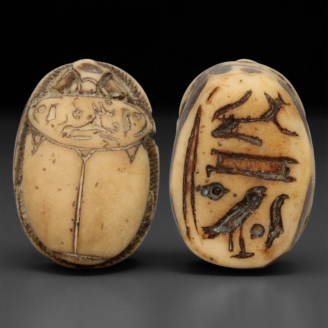 A Egyptian Hieroglyphic Inscription Steatite Scarab Seal, New Kingdom, c. 1550-1070 BCE, 3.4cm, 21ER: This finely carved steatite scarab seal, dating to Egypt's New Kingdom period (c. 1550-1070 BCE), exemplifies the refined artistry and spiritual symbolism of one of the most celebrated ages in Egyptia