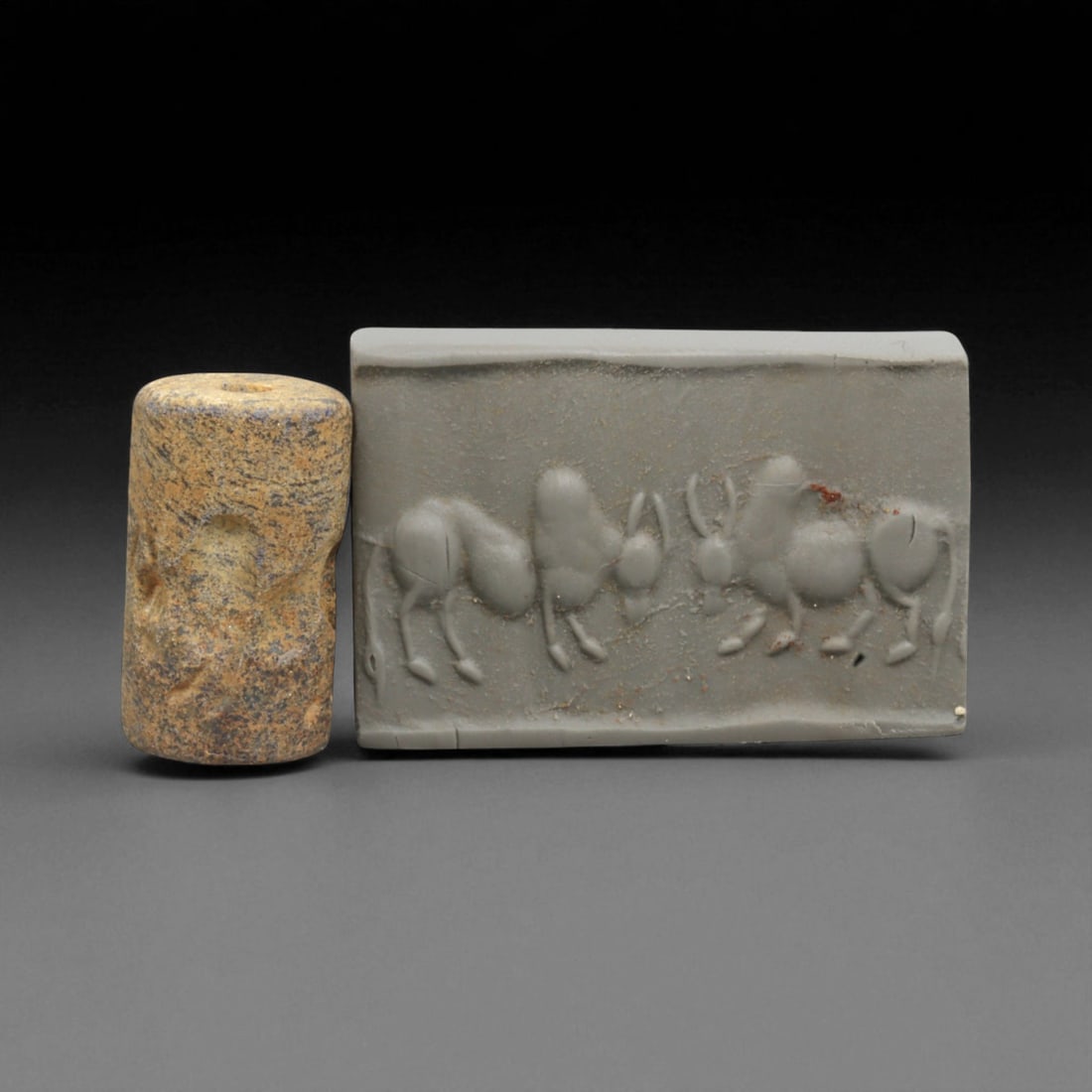 A Mesopotamian Stone Cylinder Seal, 3rd-2nd Millennium BCE, 2.3cm, 85BC: This authentic cylinder seal from ancient Mesopotamia dates to the 2nd to 1st millennium BCE, a time when the art of carving miniature narratives on stone reached remarkable levels of refinement. Seal