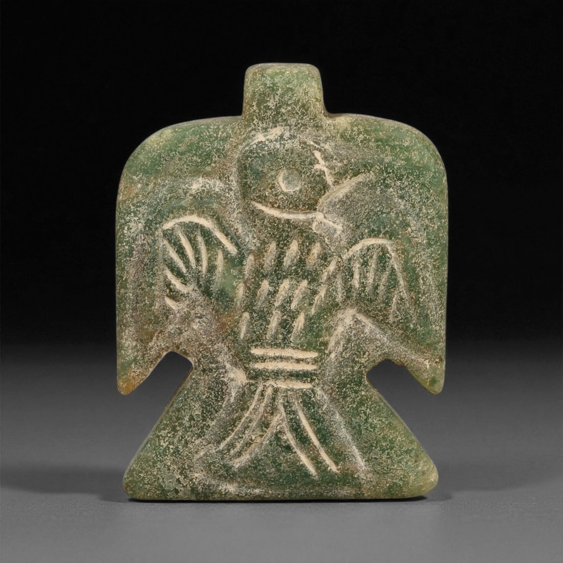 Ancient Mesopotamian Serpentine Eagle Amulet, c. Akkadian Period, 4cm, 82ES: This well-carved serpentine amulet, depicting an eagle in poised symmetry, dates to the Akkadian period of Mesopotamia (circa 2334-2154 BCE). The eagle held deep spiritual resonance in Mesopotamian be