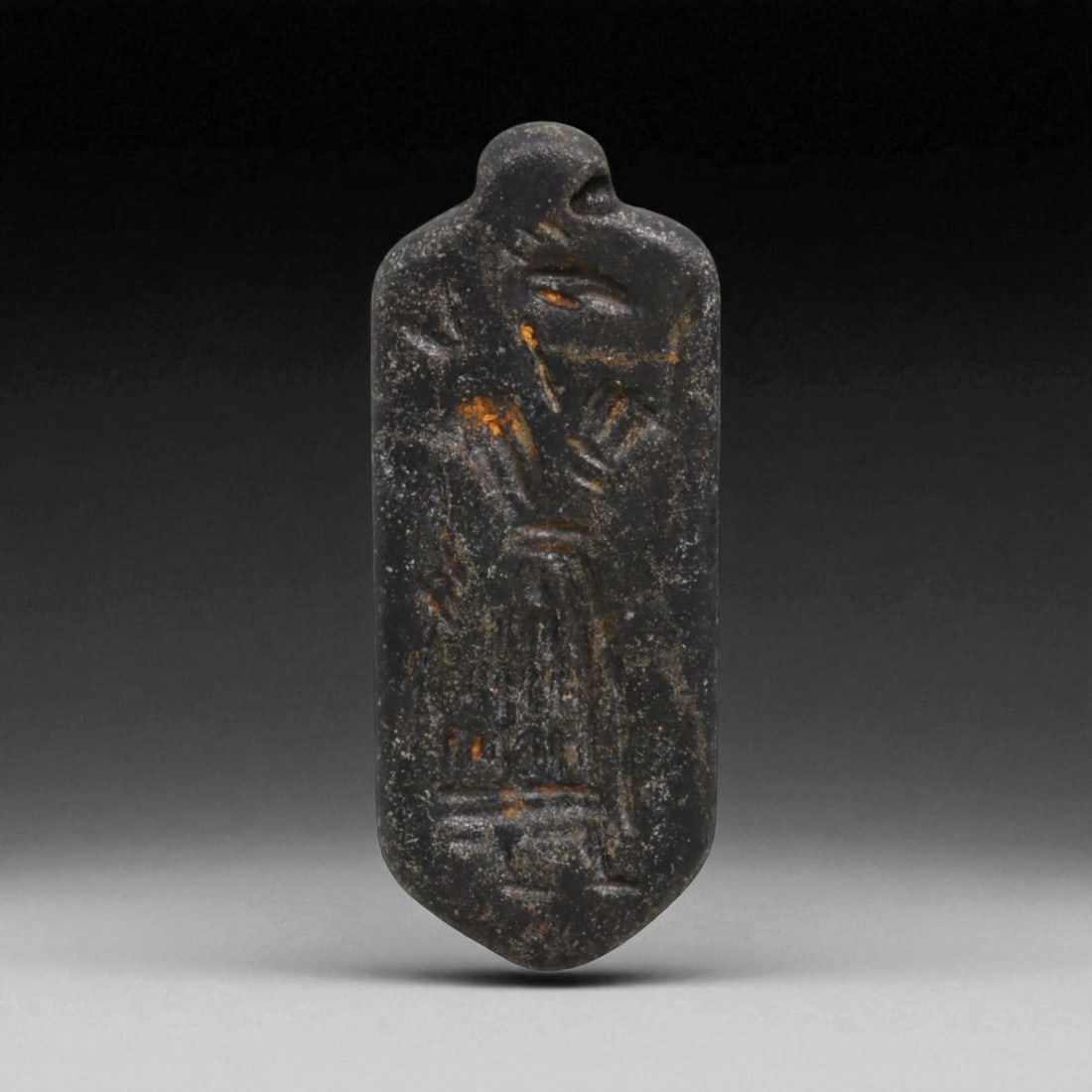Ancient Neo-Babylonian Steatite Gazelle Motif Amulet Pendant, c. 7th-6th Century BCE, 5cm, 10g, 9LH: This pendant, carved from dark steatite, dates to the Neo-Babylonian period, c. 7th-6th century BCE. Pierced at the top for suspension, it was designed as a personal amulet to be worn close to the bod