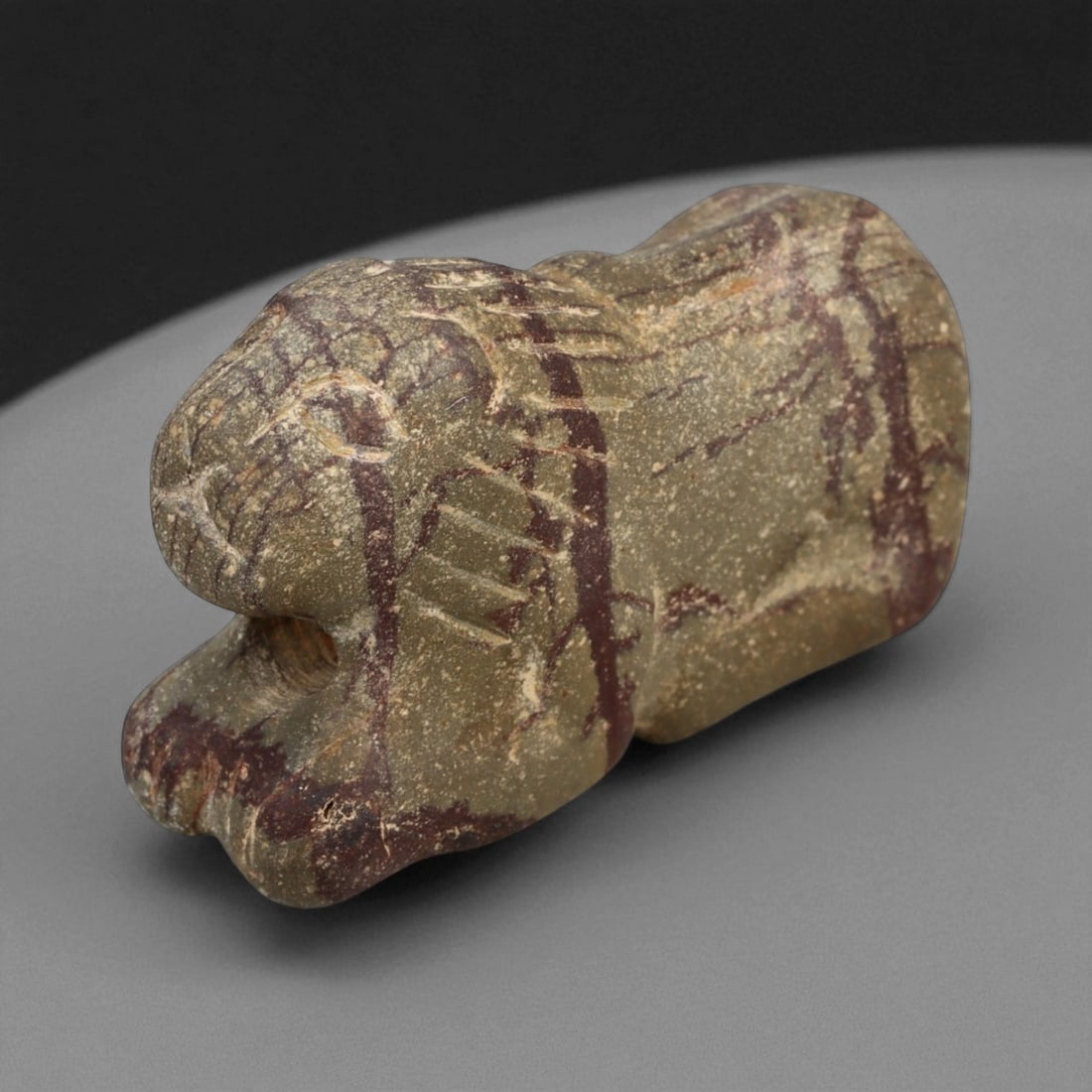 Ancient Elamite Jasper Feline Amulet, c. 18th-14th Century BCE, L 3.5cm, 15BF: This captivating jasper amulet, carved in the form of a crouching feline, dates to the Elamite period of southwestern Iran, circa 18th-14th century BCE. Compact yet powerfully modeled, the amulet capt