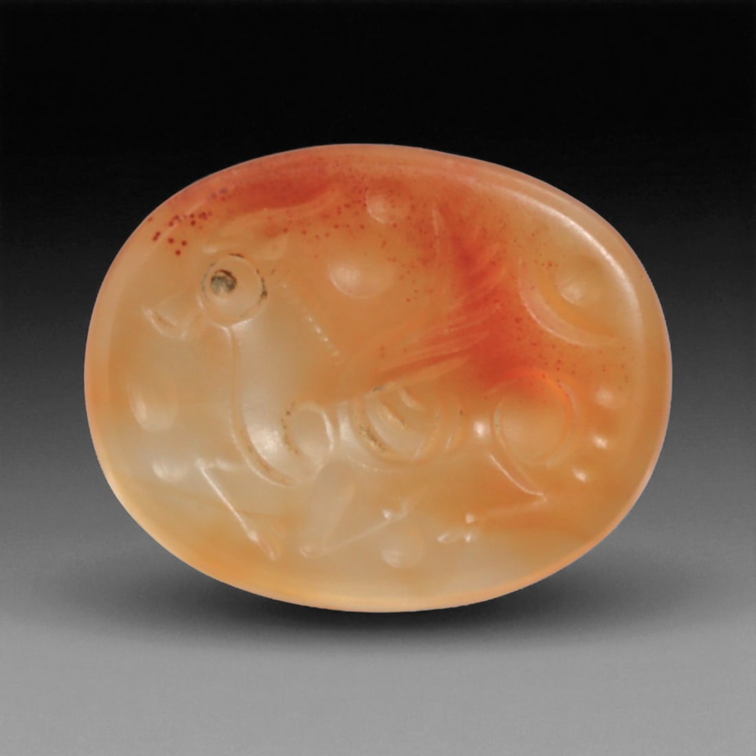 Ancient Sasanian Carnelian Intaglio with Engraving Motif, 2.1cm, 2g, 89BC: This carnelian intaglio, finely engraved into the warm red tones of semi-precious stone, reflects a tradition of craftsmanship spanning from the classical world to the early modern era. Intaglios serv