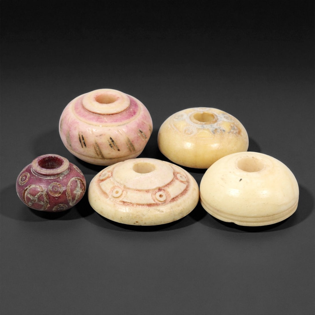 Ancient Near Eastern Bone Spindle Whorl c. 1st Mill BCE 1.2-2.2cm, 70ER: This ancient bone spindle whorl reflects the textile traditions that flourished across the Near East during the 1st millennium BCE, when finely made spinning tools were essential to daily life and oft