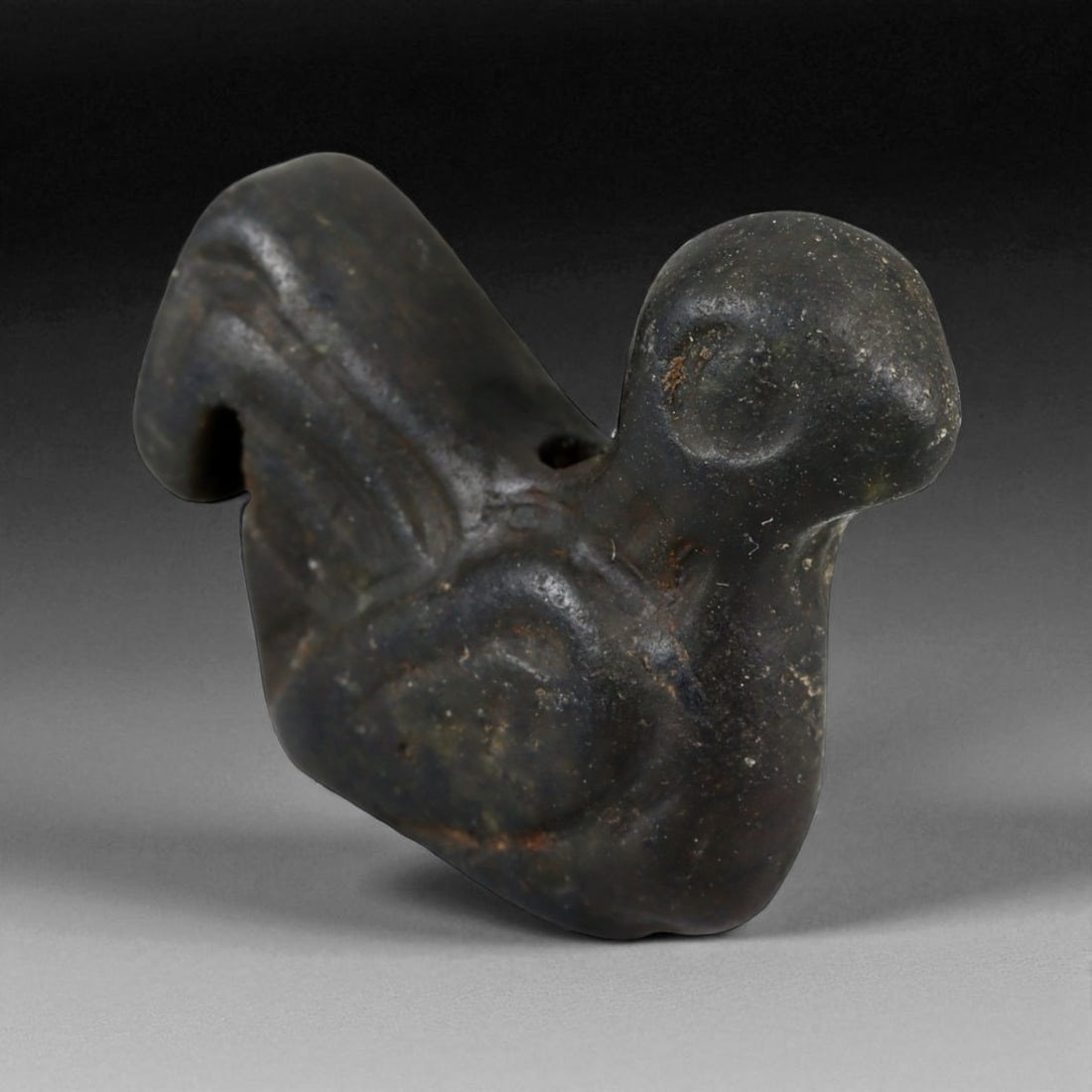 Ancient Egyptian Basalt Bird Amulet, c. Late Period, 7th-4th Century BCE 22 mm, 2A: This elegant basalt amulet, carved in the form of a stylized bird, dates to Egypt's Late Period, circa 7th-4th centuries BCE. Birds were among the most potent symbols in Egyptian iconography, represen
