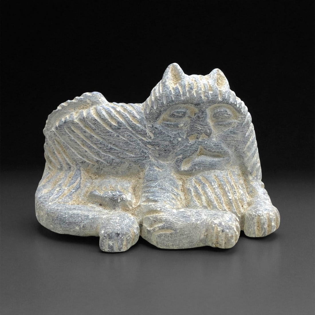 Ancient Akkadian Schist Lion-Faced Figure, c. 24th-22nd Century BCE, 7cm, 120g, 59CC: This striking schist sculpture originates from the Akkadian period of Mesopotamia, dating between the 24th and 22nd centuries BCE. Depicting a lion-bodied, human-faced guardian creature, it embodies t