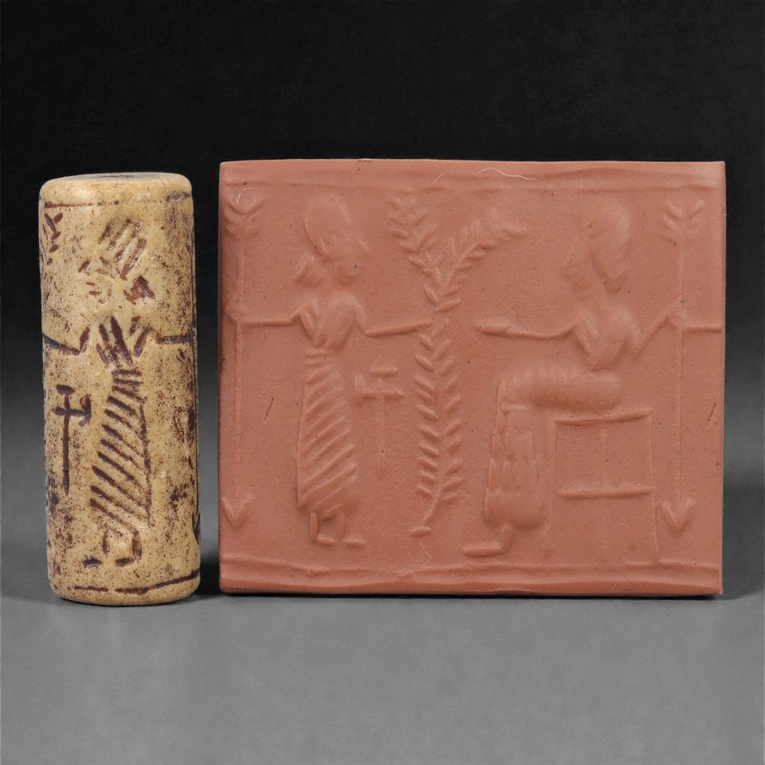 A Near Eastern Stone Cylinder Seal, 3rd Millennium BCE, 4.3cm, 44LH: Carved from stone with darker surface mottling, the cylindrical seal bears a continuous engraved scene. The carving is executed in shallow linear grooves typical of Early Bronze Age glyptic traditions