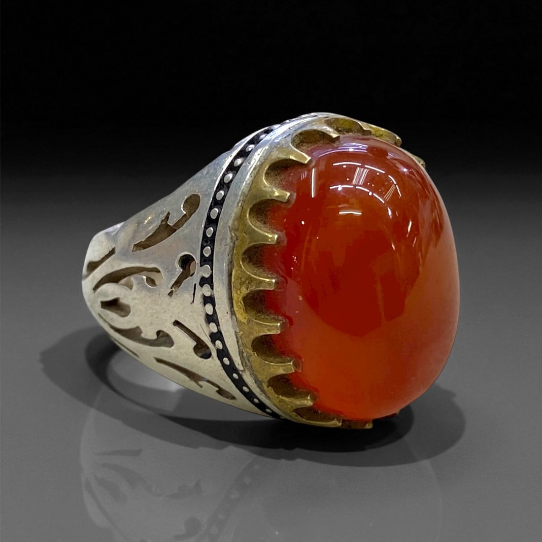 Antique Turkoman Gilded Carnelian Silver Ring, c. 19th-20th Century, US 10, 15g, 4CC: This striking antique silver ring exemplifies the bold ornamental style of Turkoman silversmiths active across Central Asia during the late 19th and early 20th centuries. At its center sits a large, d