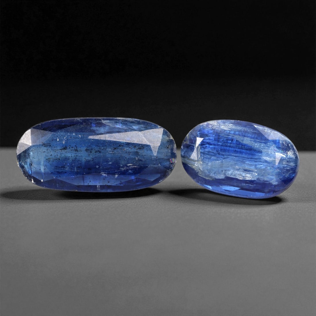 13.16 Carats Deep Blue Kyanite Oval Cut Selection - Natural Nepalese Stones - 14 to 19 mm, 25XC: This luminous selection of kyanite gems showcases vibrant shades of royal to midnight blue, with subtle silken textures that are signature to the species. Each stone is fashioned in a oval , maximizin