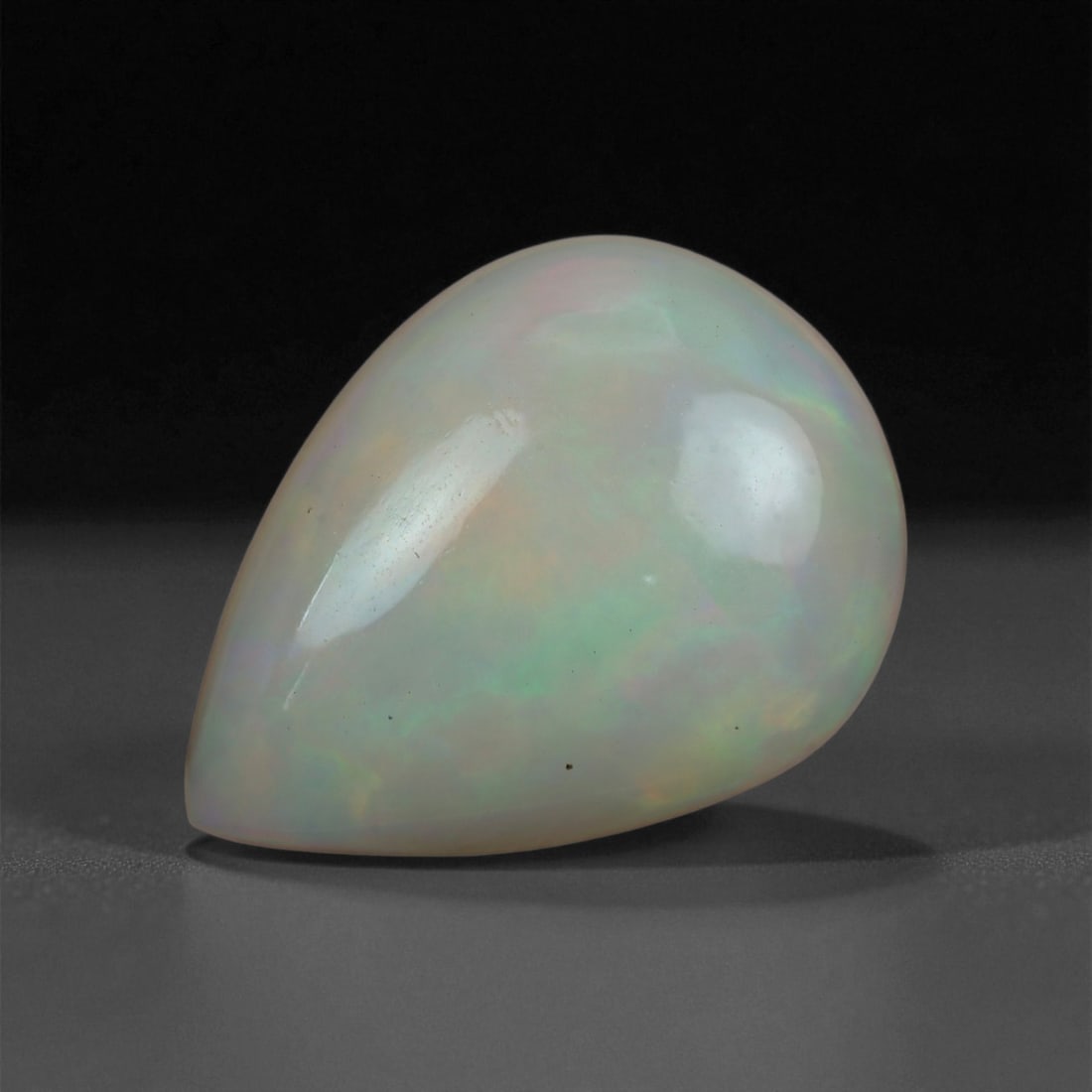 6.89 Carats Multicolor Opal Selection - Natural Welo Ethiopian Stones, 35XB: This luminous selection of Welo opals dazzles with vibrant play-of-color, ranging from electric greens and cobalt blues to sunlit oranges and flashes of violet. Each cabochon has been hand-selected fo