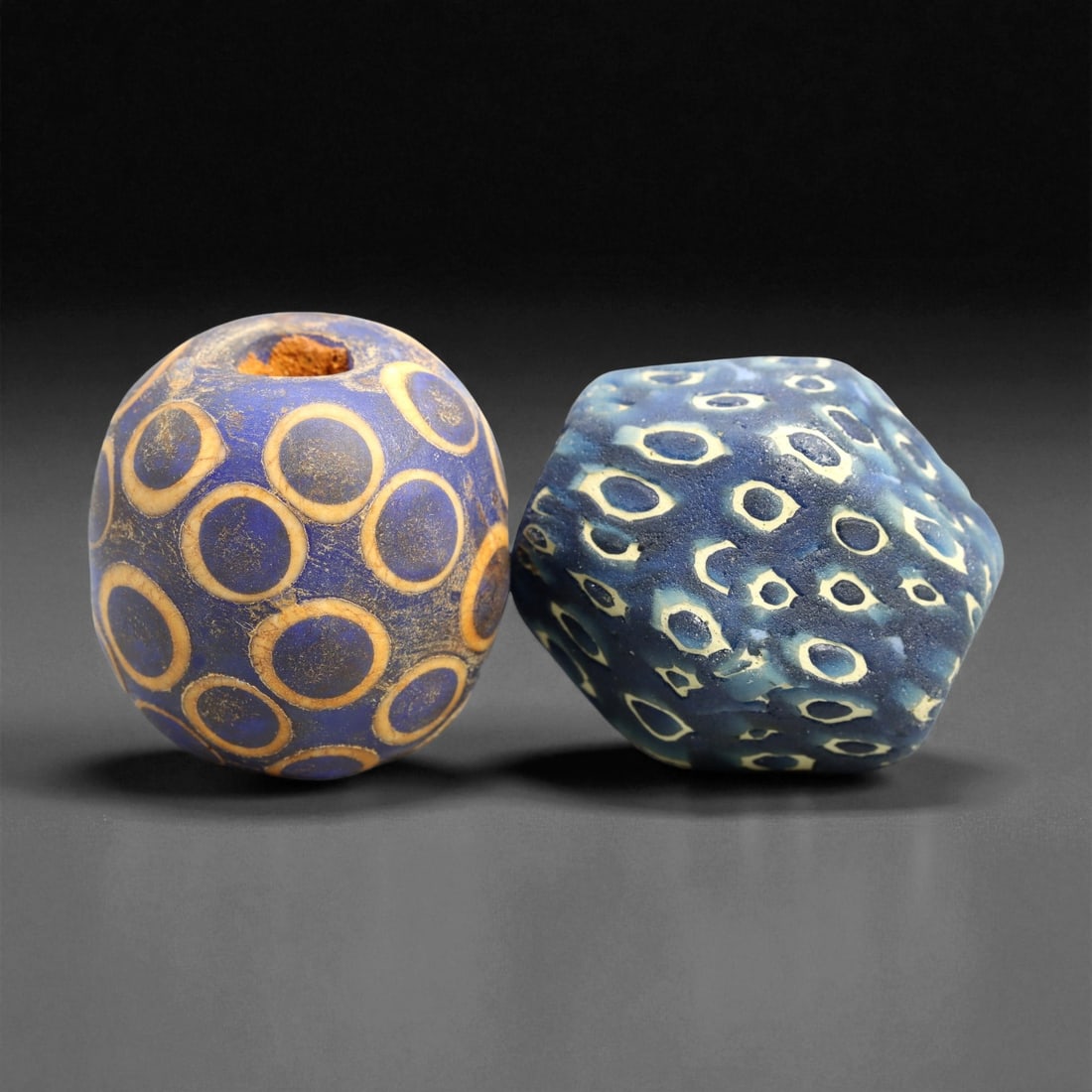 Ancient Medieval Southeast Asia Majapahit Borneo Glass Beads, c. 13th-16th Century CE, 2.5cm, 52ER: These two ancient medieval glass trade beads originate from the Majapahit period of Southeast Asia (c. 13th-16th century CE), a golden age of maritime exchange and artistic flourishing across the Indo