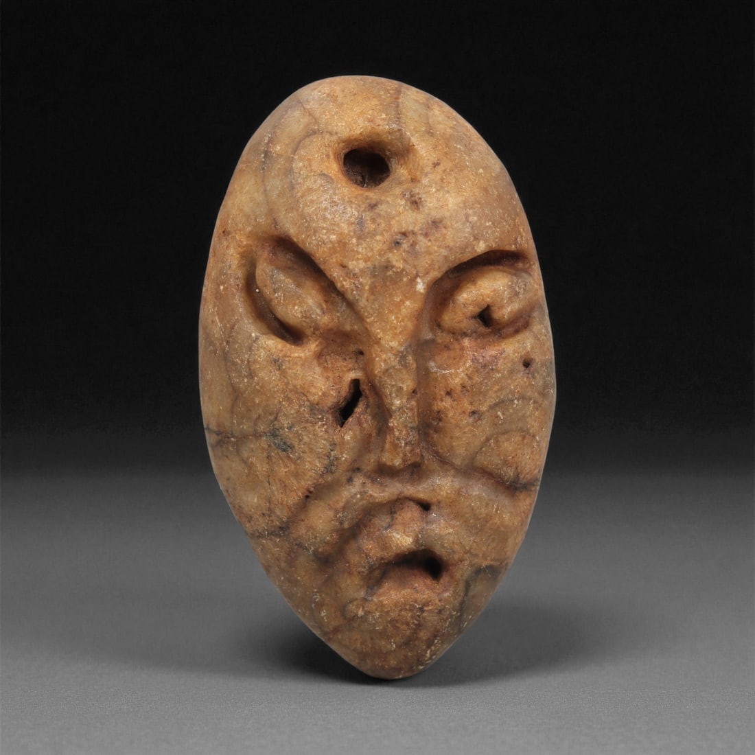 A Mediterranean Stone Maskette, 12th-17th Century, 39LC