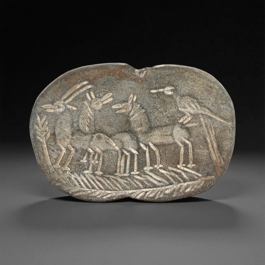 Ancient Proto-Elamite Herding Scene Steatite Plaque, c. 30th-27th Century BCE, 8.3cm, 51ES: This beautifully carved steatite plaque originates from the Proto-Elamite period of early southwestern Iran, one of the world's first great centers of civilization. The design, featuring a procession 