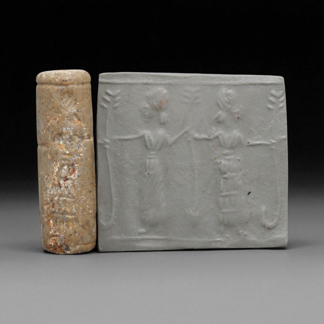 A Mesopotamian Stone Cylinder Seal, 3rd-2nd Millennium BCE, 4.6cm, 15BL: This authentic cylinder seal from ancient Mesopotamia dates to the 2nd to 1st millennium BCE, a time when the art of carving miniature narratives on stone reached remarkable levels of refinement. Seal