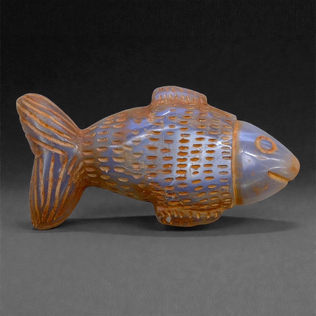 Ancient Medieval Islamic Chalcedony Fish Effigy, c. 11th-13th Century CE, 11cm, 119g, 66CC: This finely carved chalcedony fish effigy dates to the Islamic medieval period, circa 11th-13th century CE, reflecting the graceful synthesis of art, symbolism, and natural form characteristic of the 