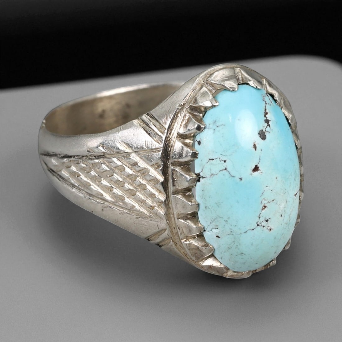 A Central Asian Silver Ring with Sky Blue Turquoise Cabochon, c. 19th-20th Century, 11 US, 15BA: This elegant A ring captures the enduring artistry of Central Asian silversmiths active during the late 19th to early 20th century. Fashioned from solid silver, it features a striking sky-blue turquoi