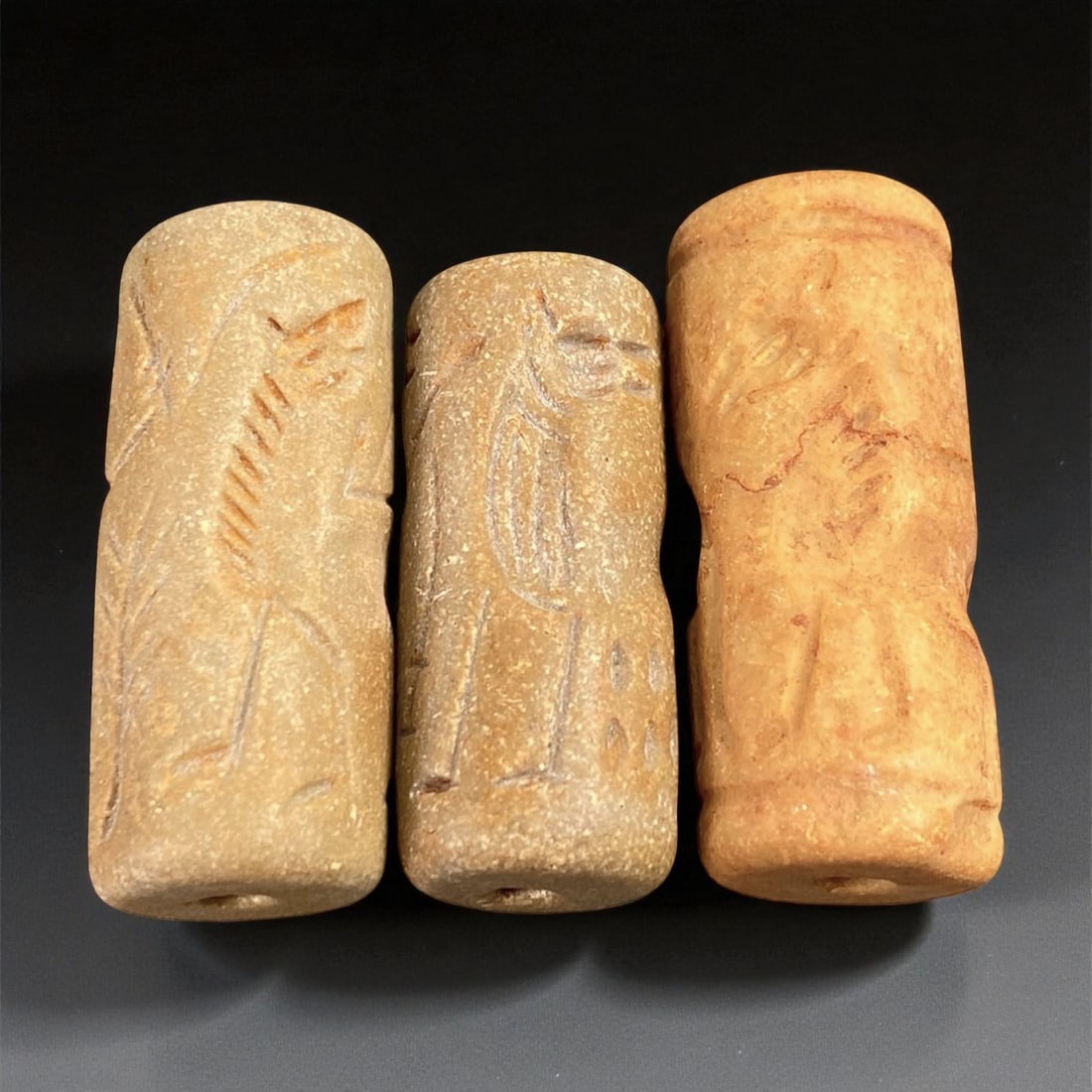 Ancient Akkadian Stone Cylinder Seals, c. 23rd-21st Century BCE, 3.5-4 cm, 91EP: These three finely carved cylinder seals originate from the Akkadian Empire, one of Mesopotamia's earliest and most influential civilizations, flourishing around the 23rd-21st century BCE. Crafted fro