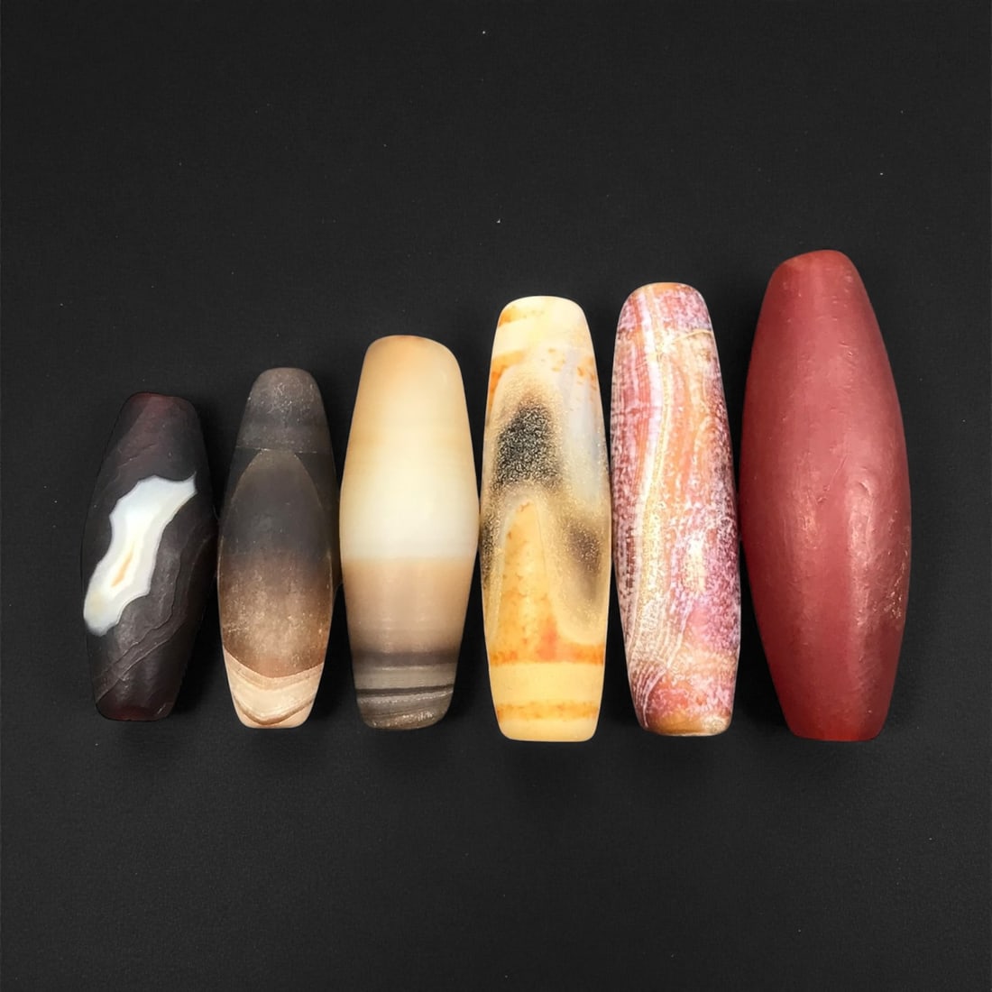Ancient Medieval Persian Agate Barrel Beads c. 10th-13th Century CE 2.6-4cm, 90ER: These ancient medieval Persian beads reflect the refined lapidary traditions that flourished across Iran during the 10th-13th centuries CE, a period marked by artistic continuity from earlier Sasanian