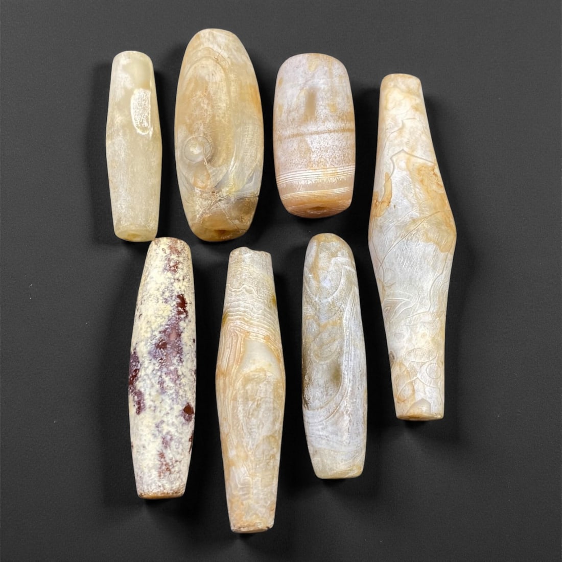 Ancient Medieval Indo-Tibetan Agate Barrel Beads, c. 10th-13th Century CE, 2.3-5cm, 51EN: This refined group of agate barrel beads originates from the Indo-Tibetan cultural sphere during the 10th-13th century CE, a period that bridged early Himalayan craftsmanship and the flourishing of Bu