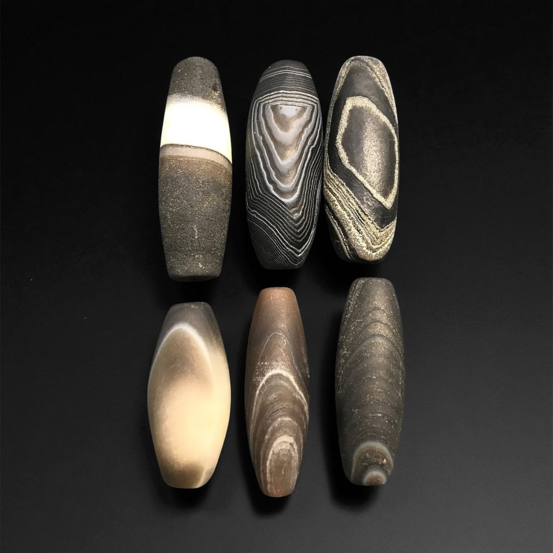 Ancient Medieval Sulaimani Agate Beads, c. 11th-14th Century CE, 2.5-3.6 cm, 18EL: This elegant group of Sulaimani agate beads originates from the Indo-Persian cultural sphere of the 11th-14th centuries CE, a period when trade and craftsmanship flourished across Central and South As
