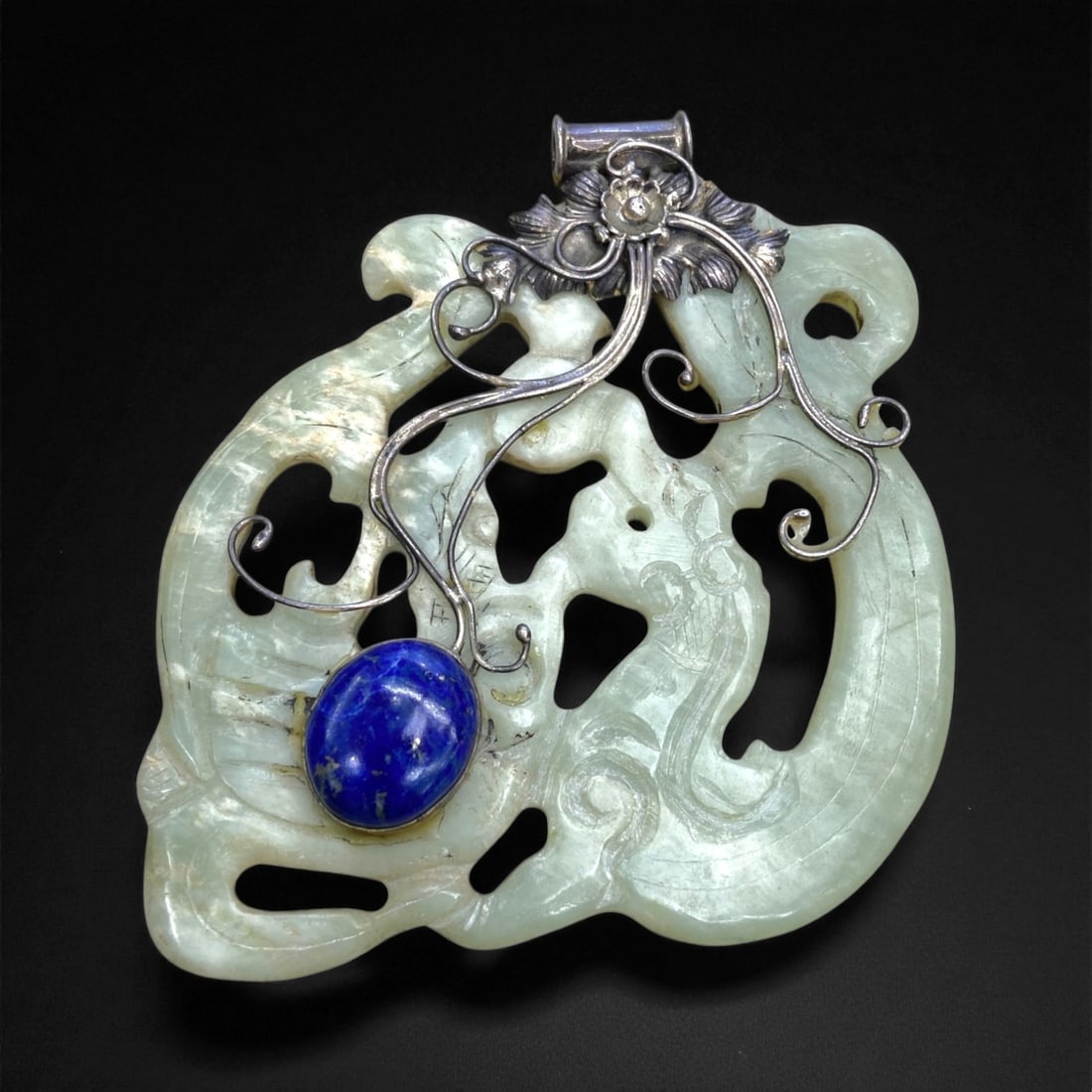 A Chinese Qing Dynasty Openwork Jade Pendant with Silver and Lapis Lazuli Mount, 8A (1 of 2)