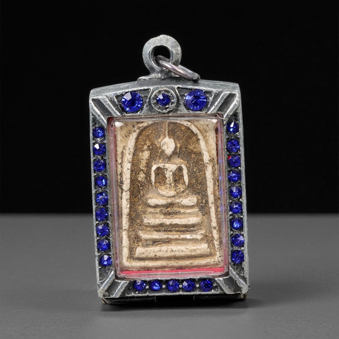 Vintage Thai Buddhist Amulet in Ornate Framed Setting, 20th Century , 6cm, 57WF: This vintage Thai Buddhist amulet exemplifies the devotional artistry that continues to define Thailand's sacred craftsmanship. Encased within an intricately detailed frame, the amulet displays refine